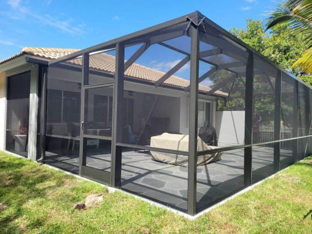 Backyard lanai screen enclosure installation in Port Orange, FL for homeowners